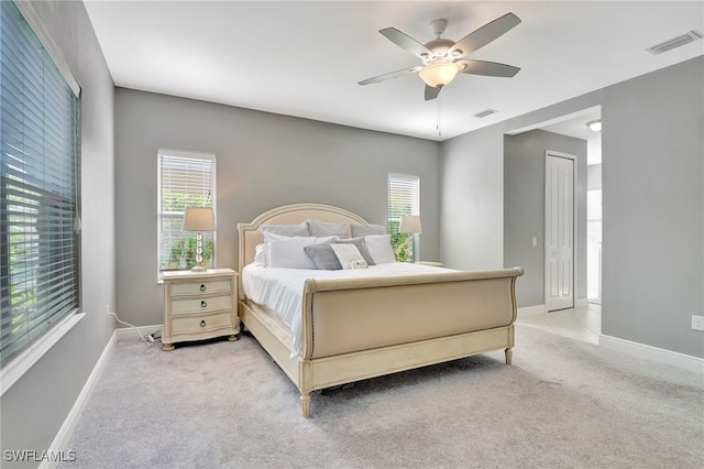 carpeted bedroom with a closet and ceiling fan