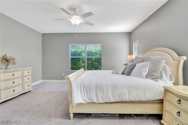 bedroom featuring light carpet and ceiling fan