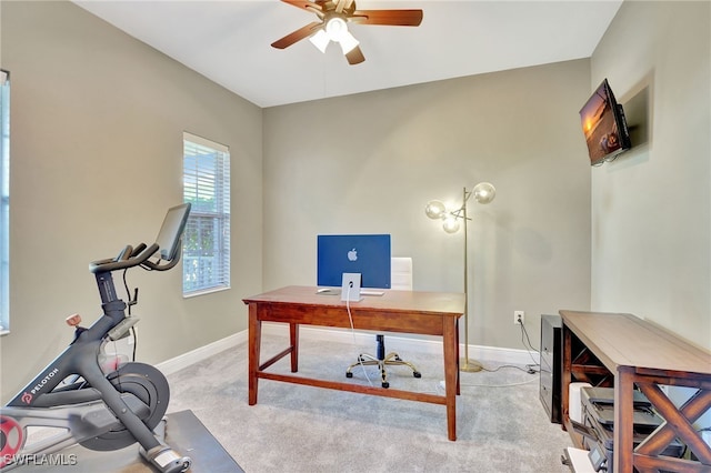 office space featuring ceiling fan and light colored carpet