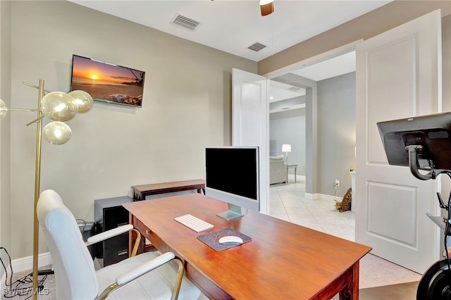 tiled office featuring ceiling fan