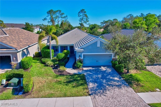 view of front facade with a garage and a front lawn