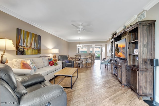 living area with ornamental molding, light wood finished floors, and ceiling fan with notable chandelier