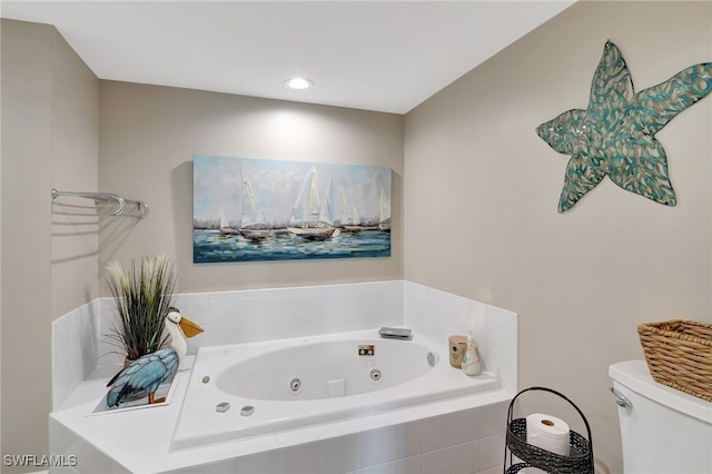 bathroom featuring a relaxing tiled tub and toilet