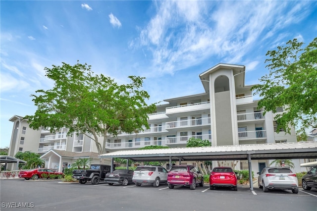 view of building exterior with covered parking