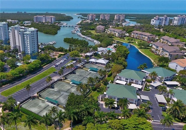 birds eye view of property featuring a view of city and a water view