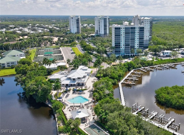 birds eye view of property with a water view