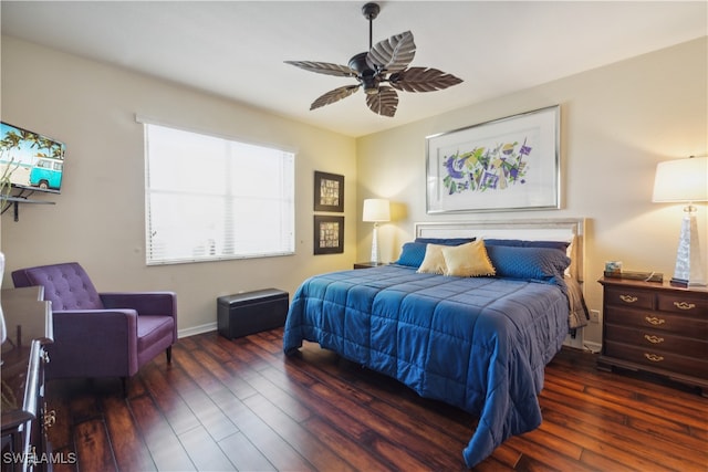 bedroom with ceiling fan and dark wood-type flooring