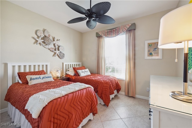 bedroom featuring light tile patterned floors and ceiling fan