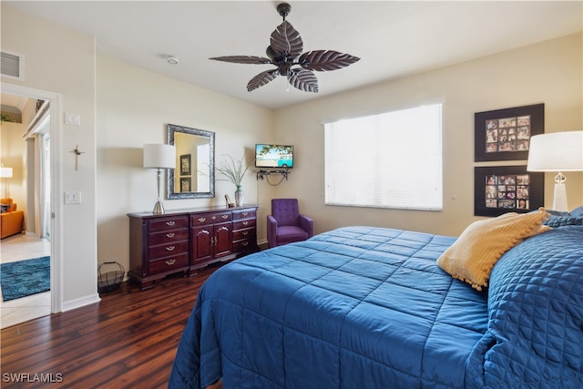 bedroom with ceiling fan and dark hardwood / wood-style floors