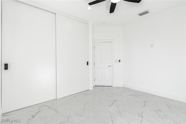 unfurnished bedroom featuring a closet and ceiling fan