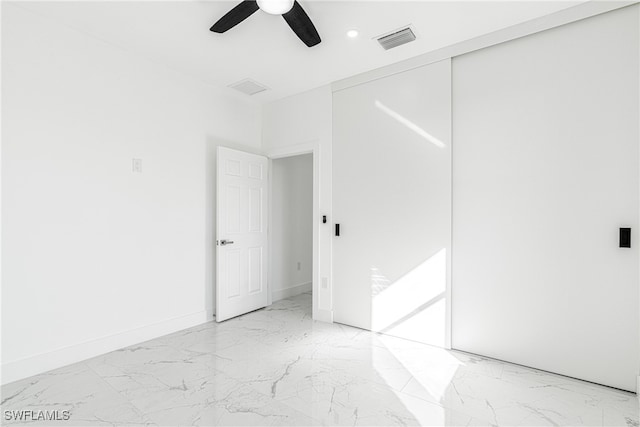 empty room featuring ceiling fan