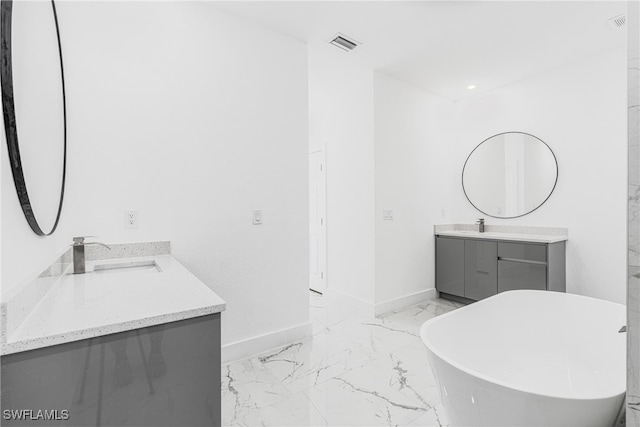 bathroom featuring vanity and a bathtub