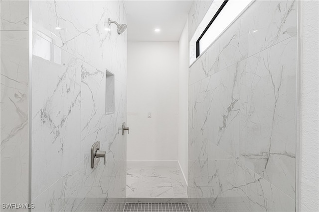 bathroom with tiled shower