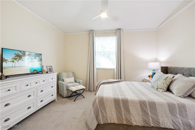 carpeted bedroom featuring crown molding and ceiling fan