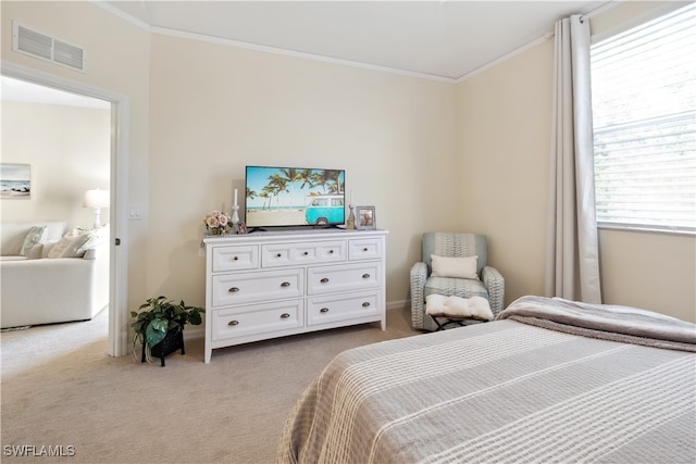 carpeted bedroom featuring ornamental molding