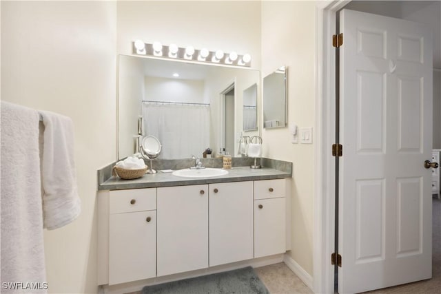 bathroom with vanity and a shower with curtain