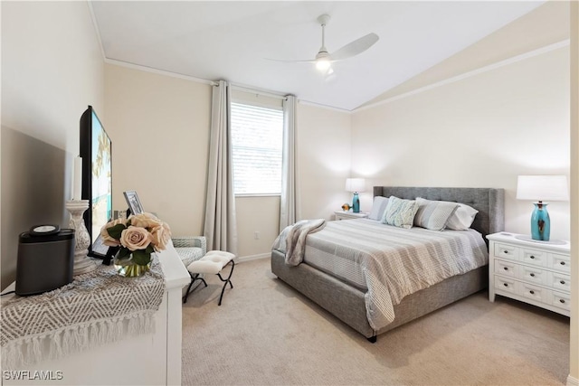 bedroom featuring ornamental molding, lofted ceiling, light colored carpet, and ceiling fan