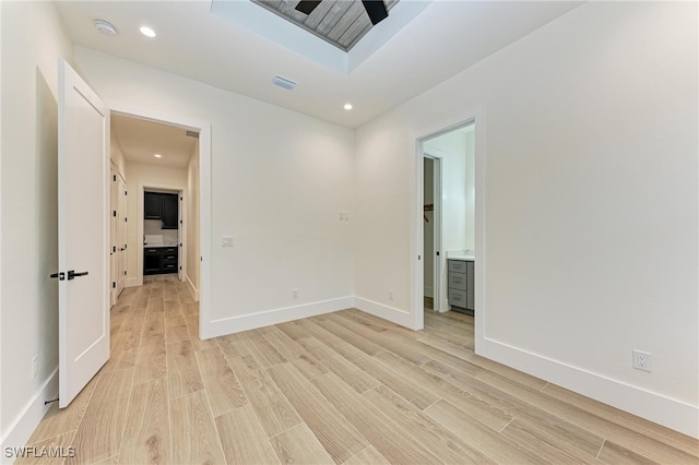 empty room with light hardwood / wood-style floors