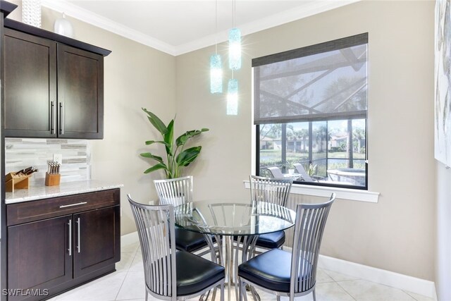 tiled dining space with ornamental molding