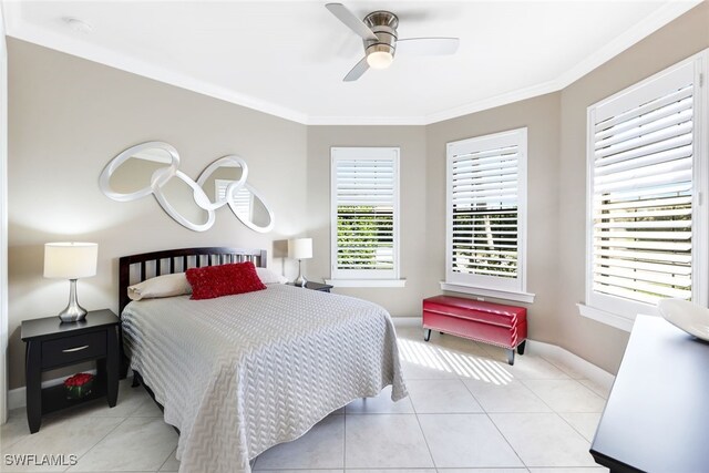 bedroom with light tile patterned floors, ceiling fan, and ornamental molding