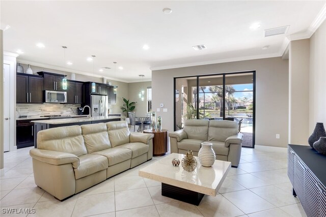 tiled living room featuring ornamental molding