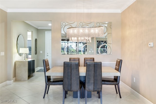 dining area featuring ornamental molding, light tile patterned floors, and a chandelier