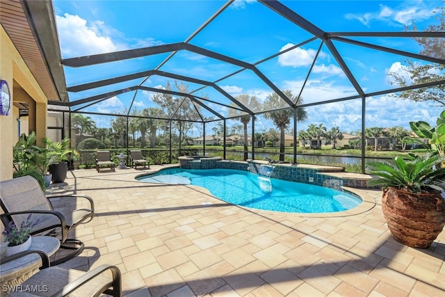 view of pool featuring glass enclosure, a patio area, and a water view