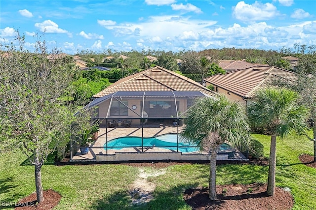 exterior space featuring a yard, a patio area, and a lanai