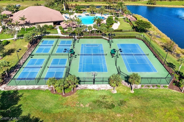 birds eye view of property with a water view