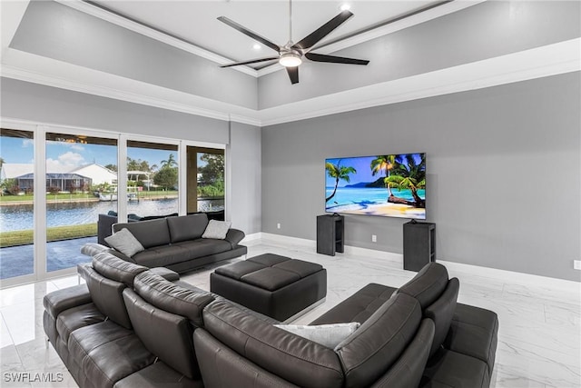 2038 Bahama Ave, Fort Myers, FL 33905 - living room featuring marble tiled flooring, a ceiling fan, ornamental molding, baseboards, and a towering ceiling