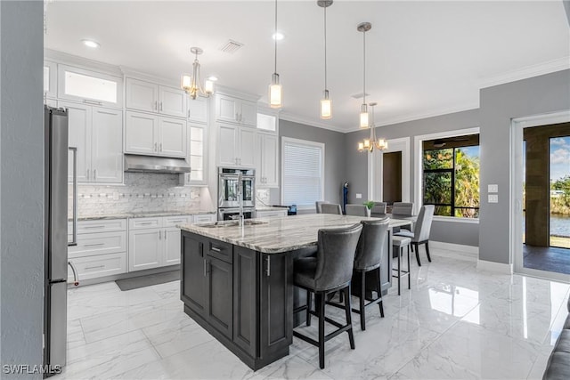 2038 Bahama Ave, Fort Myers, FL 33905 - kitchen featuring a chandelier, light marble finish flooring, stainless steel double oven, white cabinetry, and ornamental molding