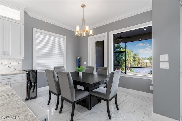 2038 Bahama Ave, Fort Myers, FL 33905 - dining area with light marble finish flooring, a chandelier, baseboards, ornamental molding, and a water view