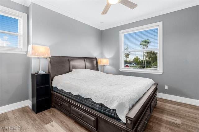 2038 Bahama Ave, Fort Myers, FL 33905 - bedroom with ornamental molding, multiple windows, wood finished floors, and baseboards