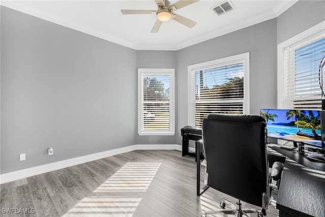 office space with crown molding, ceiling fan, and light hardwood / wood-style floors