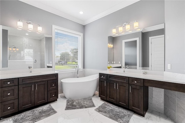2038 Bahama Ave, Fort Myers, FL 33905 - bathroom featuring two vanities, a freestanding tub, ornamental molding, marble finish floors, and recessed lighting