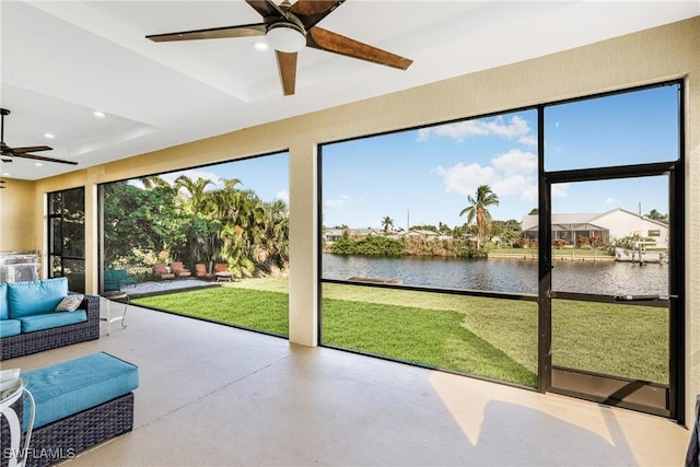2038 Bahama Ave, Fort Myers, FL 33905 - unfurnished sunroom with ceiling fan, a water view, and outdoor lounge area