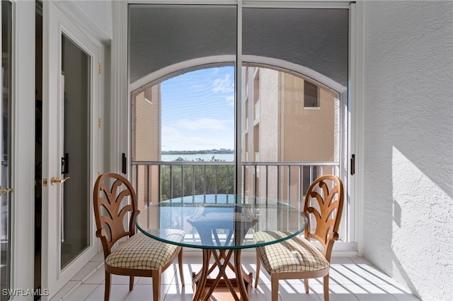 sunroom with a water view