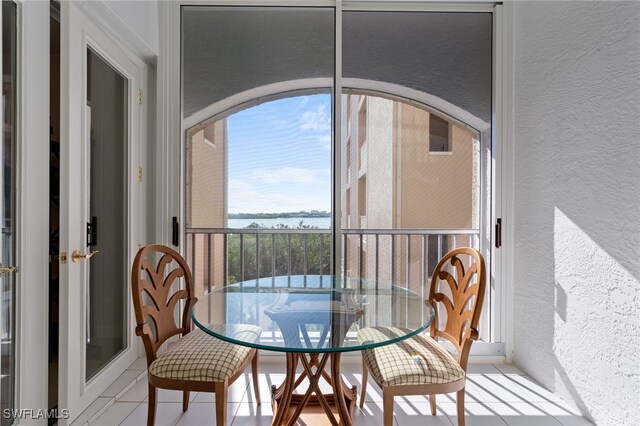 2000 Royal Marco Way Unit 2-407, Marco Island, FL 34145 - balcony featuring a water view and outdoor dining space