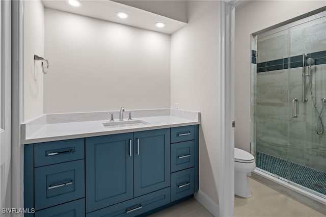 bathroom featuring tile patterned floors, walk in shower, vanity, and toilet