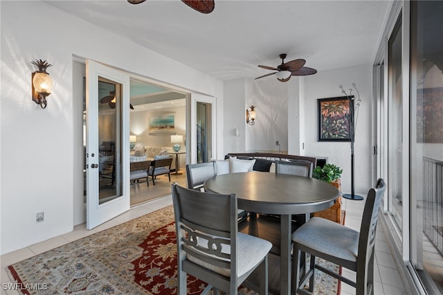 dining room featuring light tile patterned floors and ceiling fan