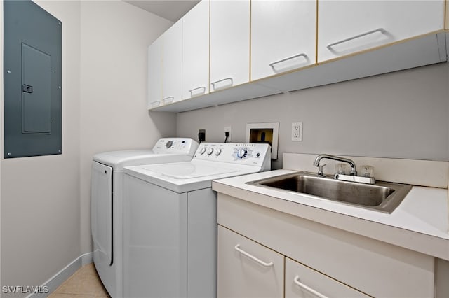 washroom with sink, cabinets, electric panel, washer and clothes dryer, and light tile patterned floors