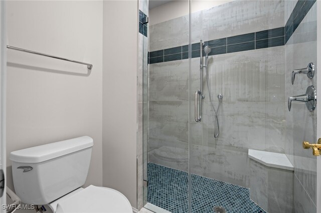 2000 Royal Marco Way Unit 2-407, Marco Island, FL 34145 - bathroom featuring toilet and a shower stall
