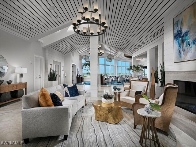 2000 Royal Marco Way Unit 2-407, Marco Island, FL 34145 - living room with a chandelier, vaulted ceiling, and a fireplace
