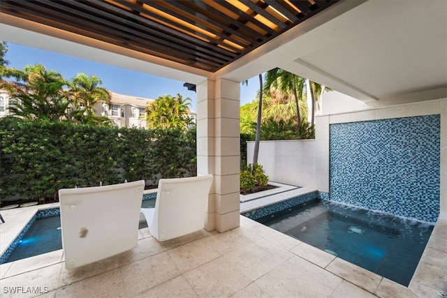 view of patio featuring a jacuzzi