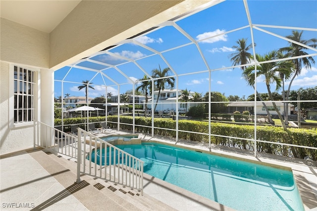 view of pool featuring a patio area and a lanai