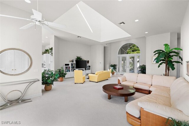 living room with french doors, carpet floors, ceiling fan, and lofted ceiling