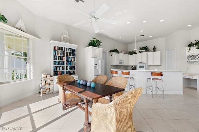 dining room with ceiling fan and light tile patterned floors