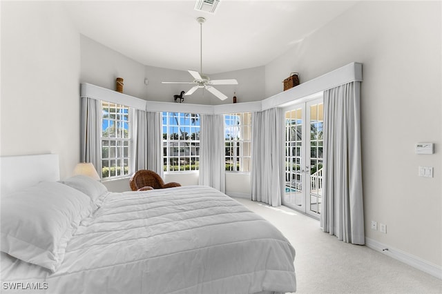 carpeted bedroom featuring access to exterior, ceiling fan, and french doors