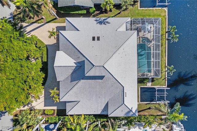 birds eye view of property with a water view