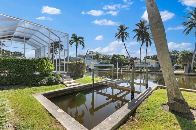 dock area with a water view and glass enclosure